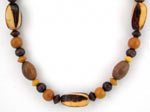 dark and medium brown wood necklace with burnt wood barrel