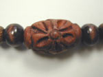Carved wood bead close up