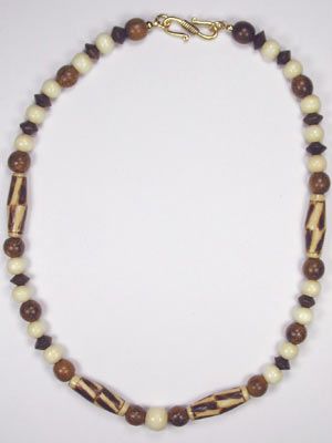 brown and beige necklace with burnt wood rice